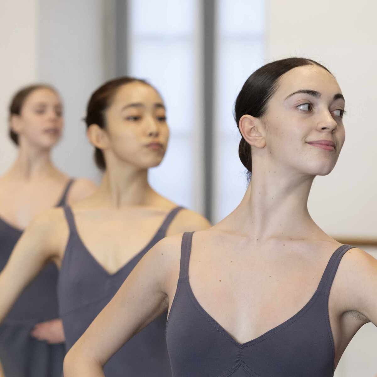 A group of young dancers in blue body