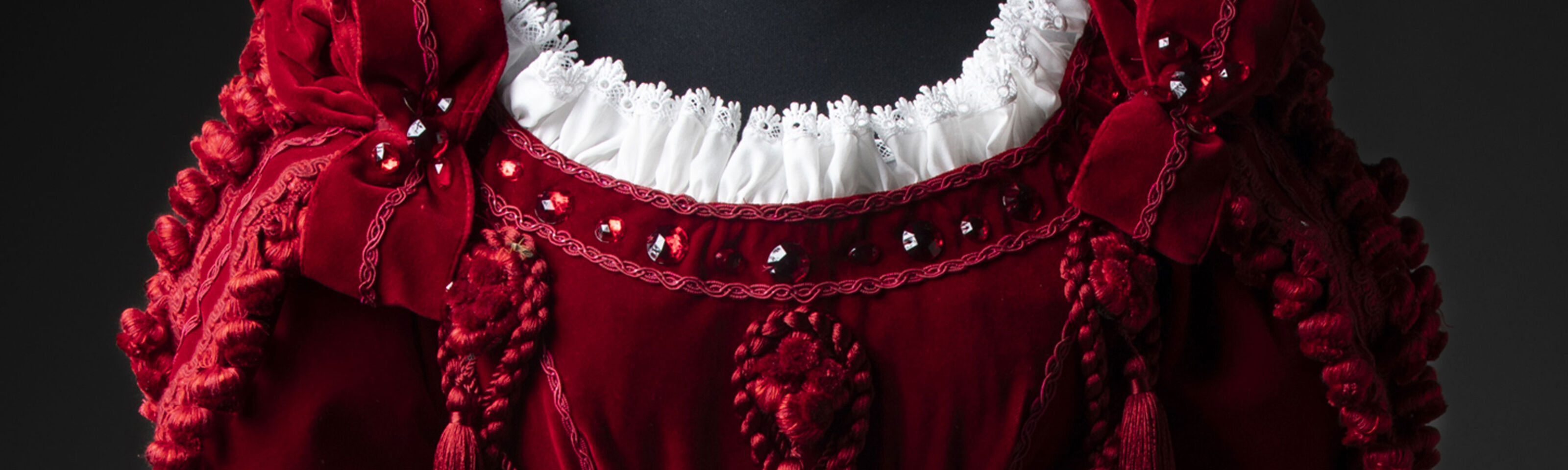 A detail of red velvet theatrical costume